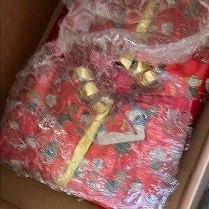 Festive Red Gift Wrap with Gold Ribbon